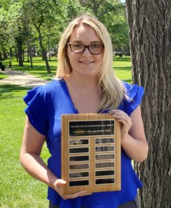 Haley Steran holding the moot award on behalf of her team-mates!